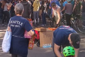 Seattle firefighters pass out masks